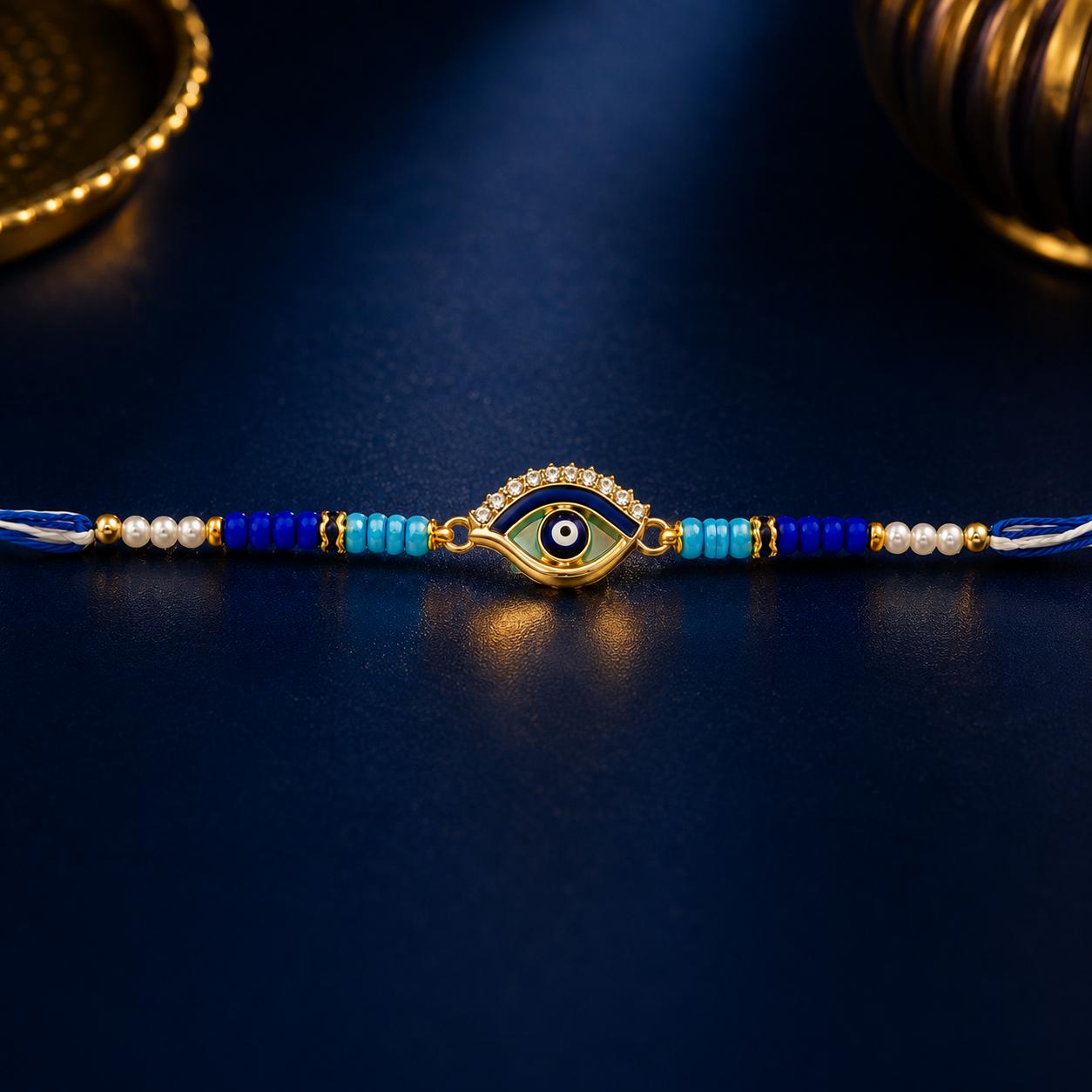 Evil Eye Designer Rakhi With Blue Beads For Men & Boys(1 Rakhi With Roli, Chawal, Chandan & Mishri Pack) - Image 2