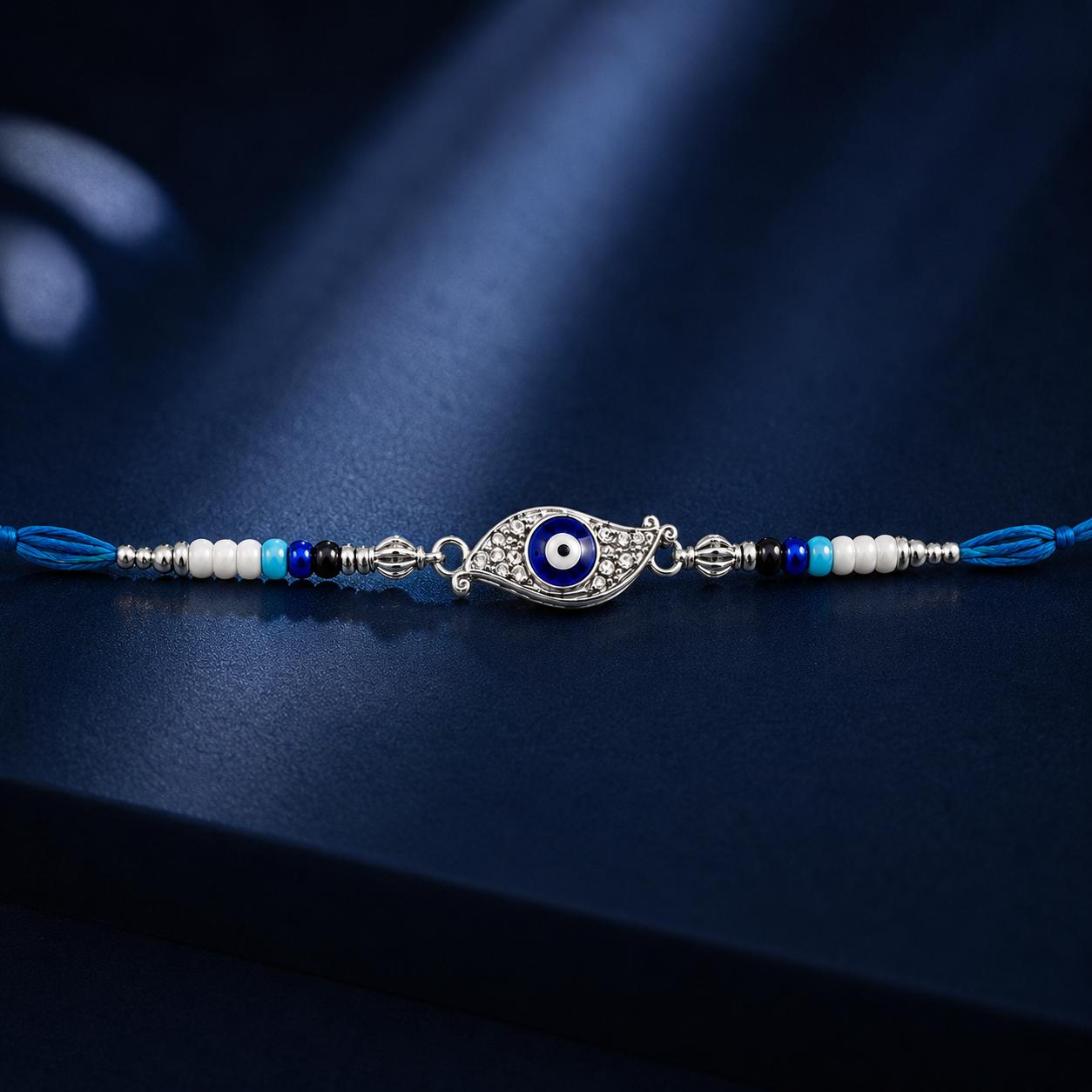 Evil Eye Designer Rakhi With Blue White Beads For Men & Boys(1 Rakhi With Roli, Chawal, Chandan & Mishri Pack) - Image 2