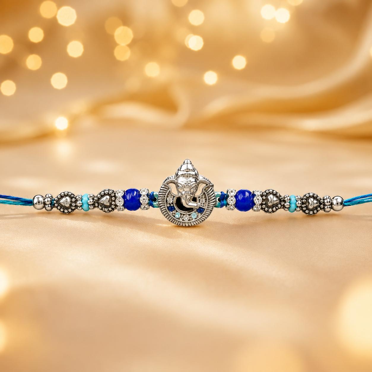 Lord Ganesha Designer Rakhi With Blue Beads For Men & Boys(1 Rakhi With Roli, Chawal, Chandan & Mishri Pack) - Image 7